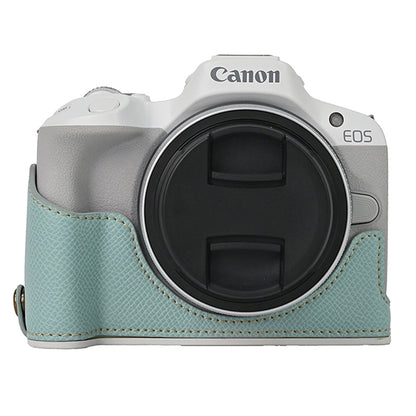 For Canon EOS R50 / R100 Anti-Shock PU Leather Camera Bottom Cover Large Opening Design Half Body Case with Strap